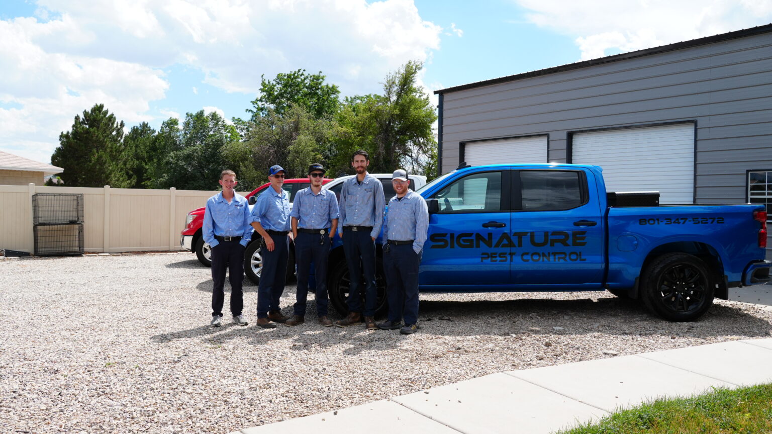 The Signature Pest Control team with a company truck
